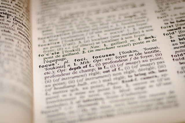 an opened dictionary with most lines blurred but the word "focus" being sharp an opened dictionary with most lines blurred but the word "focus" being sharp